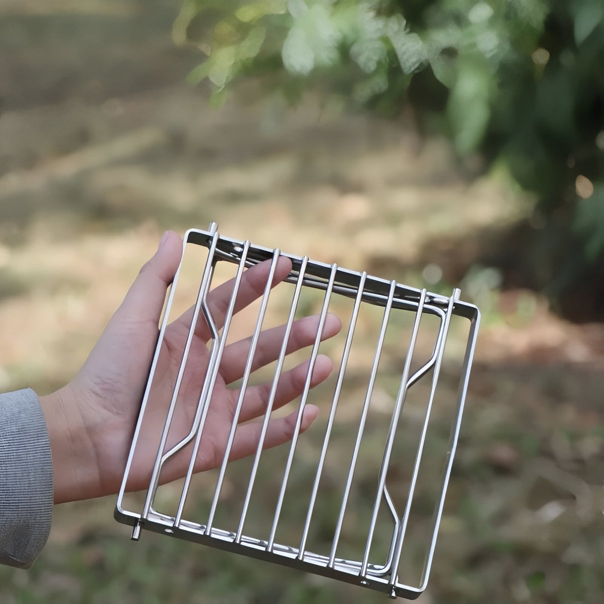 Grille De Cuisson Pour Réchaud À Gaz portée à la main